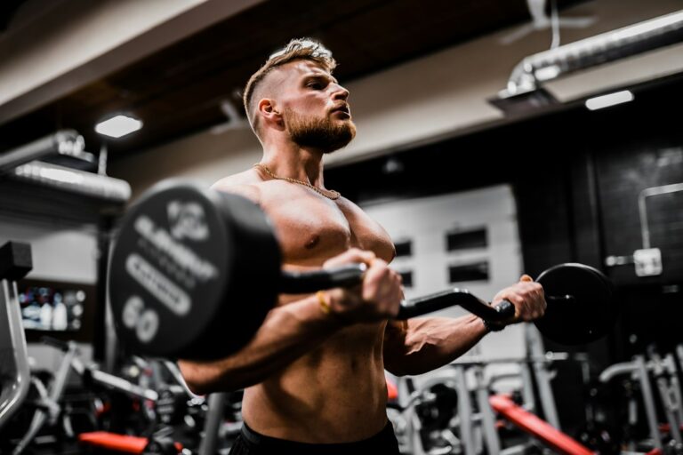 Beginner performing controlled dumbbell exercises in a bright, well-ventilated workout space.